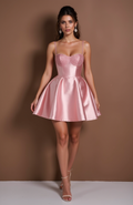 Blush pink satin mini dress with glitter lace bustier and flared pleated skirt.