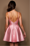 Light pink satin mini dress with lace bustier and flared skirt.