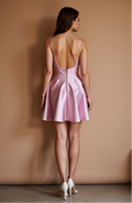 Mauve satin mini dress with lace trim, flared skirt, and low back.








