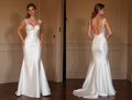 Elegant white satin mermaid gown with lace straps, fitted bodice, and low open back.
