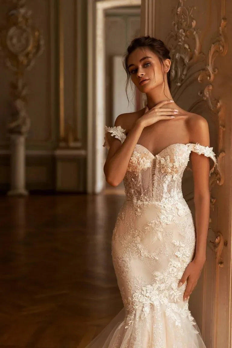 Glamorous Mermaid Wedding Gown with Off-Shoulder Sweetheart Neckline, Delicate Lace Details, and a Flattering Dropped Waist for a Breathtaking Bridal Look
